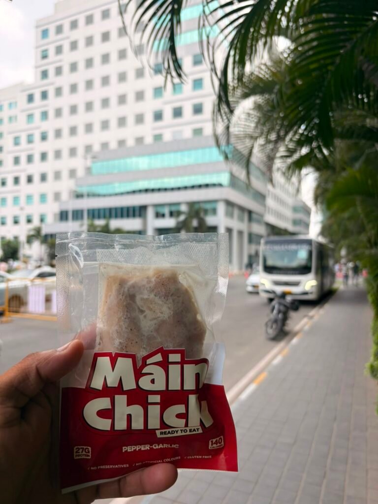 Máin Chick Pepper-Garlic pack held up on a Chennai street